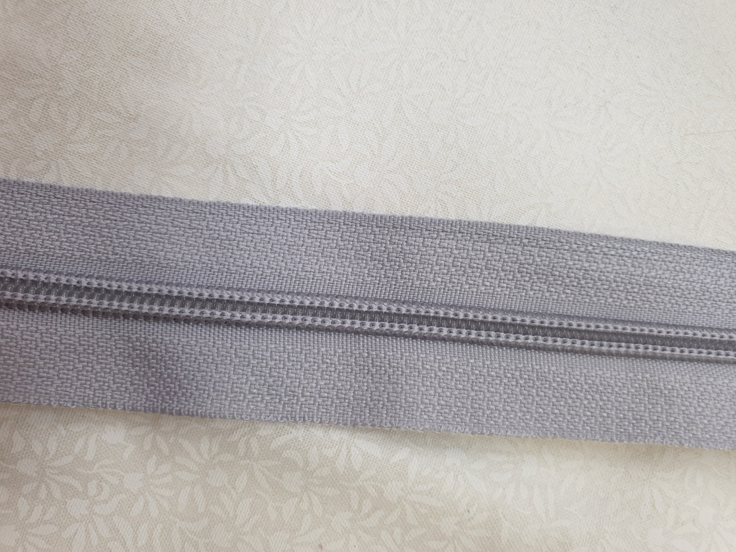 Endlos reißverschluss in hellen Grau